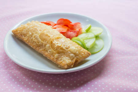 Corn pie with dish on table.