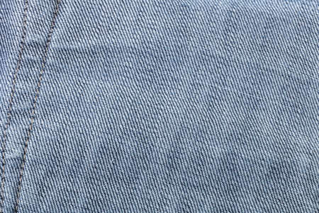 texture fragment of the old worn blue denim.の写真素材