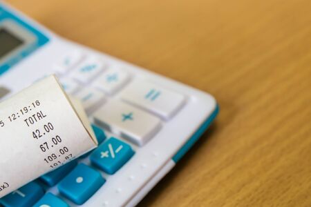 Close up of receipt paper and caculator, paymentの写真素材
