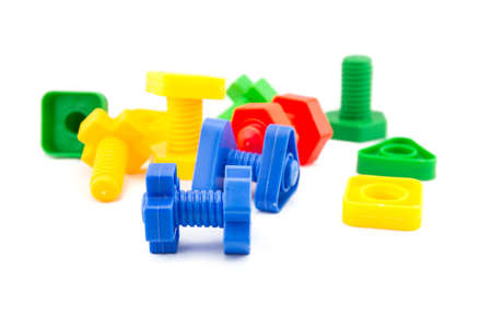 Colorful and funny nuts and bolts toys isolated on white backgroundの写真素材