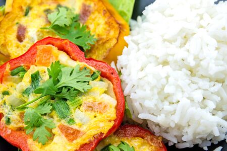 Scrambled eggs fried in the ring of sweet pepper.の写真素材