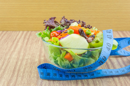 Fresh mixed vegetables salad and measure.の写真素材