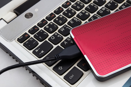 External HDD over notebook keyboard, selective focus