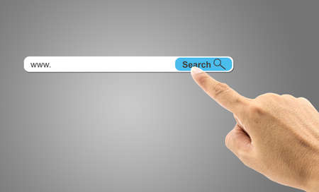 Finger clicking a search buttonの写真素材
