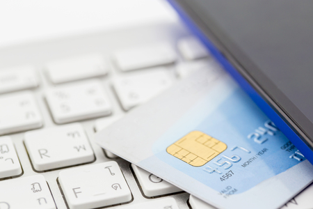 Credit cards on the keyboard,close up photoの写真素材