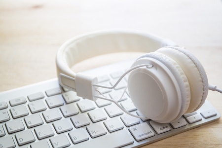 office headphones and white keyboard