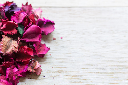 aromatherapy of dried flower petals on wood background.の写真素材