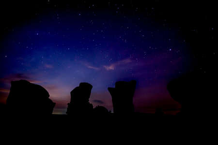 silhouette stone against a blue sunriseの写真素材