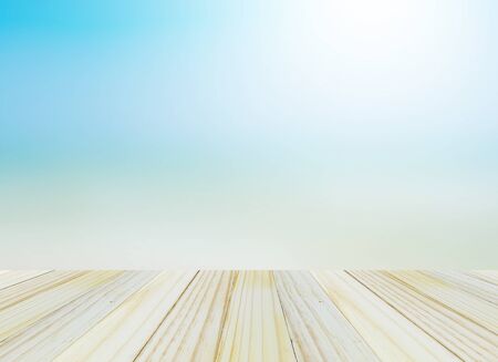 Wood table top on blurred beach background, summer concept - can be used for display or montage your productsの写真素材