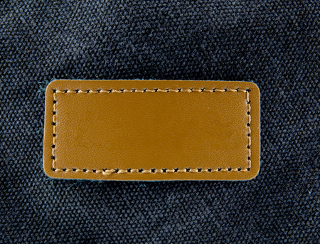 label on old black leather backgroundの写真素材