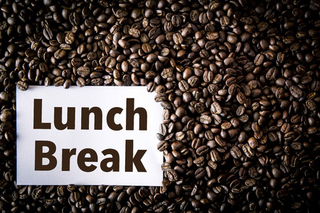 coffee seed on beans and note paper lunch break textの写真素材