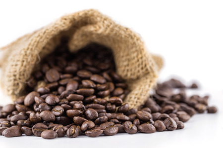 coffee beans in bag isolated on white backgroundの写真素材