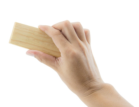 Hand holding brush erase isolated on white background, Teacher cleaning the chalkboard, Hand erasing the whiteboardの写真素材