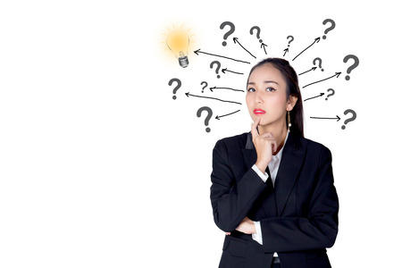 woman is standing with a light bulb and question marks isolated on white backgroundの写真素材