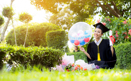 Happy graduated student girl - congratulations of education success.の写真素材