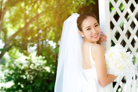 Asian woman bride at outdoor in a morning.の写真素材