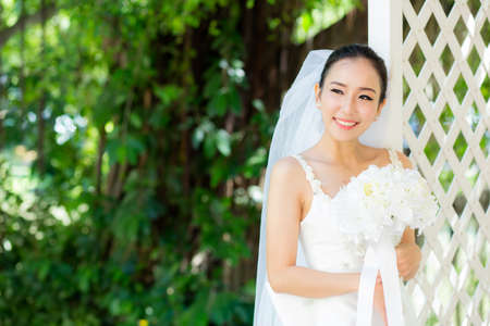 Asian woman bride at outdoor in a morning.の写真素材