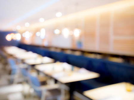 Blur abstract bokeh light background with restaurant or coffee shop or pub modern luxury style with people celebrate and dinning warm tone. For create montage product display.の写真素材