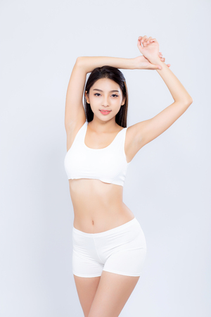 Portrait young asian woman smiling beautiful body diet with fit isolated on white background, model girl weight slim with cellulite or calories, health and wellness concept.の写真素材