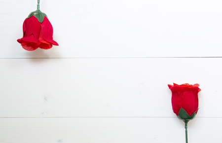 Present gift with red rose flower on wooden table, 14 February of love day with romantic, valentine holiday concept, top view.の写真素材