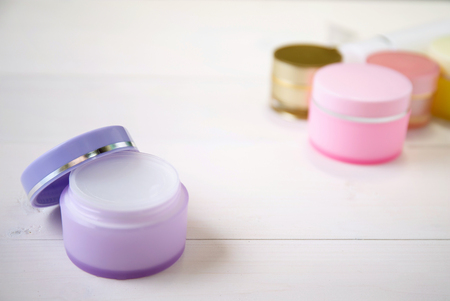 cosmetic and skin care product on white wood table, beauty with treatment cream and moisturizer on wooden desk, health and wellness concept.の写真素材