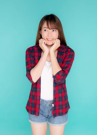 Beautiful portrait young asian woman smiling and surprise wearing travel summer fashionの写真素材