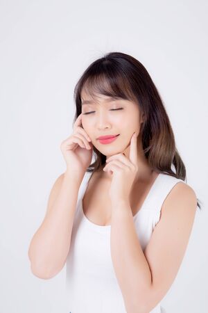 Beautiful woman asian makeup of cosmetic, beauty asia girl hand touch cheek and smile attractive, face of beauty perfect with wellness isolated on white background with skin healthcare concept.の写真素材