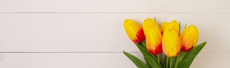 Beautiful tulip flower on wooden background with romantic, mother day or valentine day, spring or...