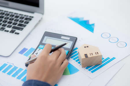 Hand of business man agent calculating loan of finance and investment for real estate, businessman...