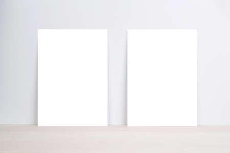 Blank paper sheet copy space with mockup on wooden table, poster and invitation with empty on desk,...