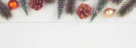 Christmas holiday composition decoration on wooden background, new year and xmas or anniversary with presents on wood table in season, celebrate and copy space, top view or flat lay, banner website.の写真素材