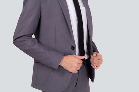 Closeup young asian businessman in suit with confident and friendly isolated on white background,...