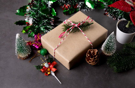 Christmas holiday composition with gift box and decoration, new year and xmas or anniversary with presents on cement floor background in season, top view.の写真素材