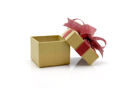Gold gift box and ribbon open isolated on white background, presents in valentine day or Christmas...