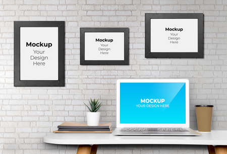 Mockup template monitor of computer display screen and picture frame with blank on desk, workplace and office, poster on wall, interior room, indoor, copy space, business and workspace concept.の写真素材