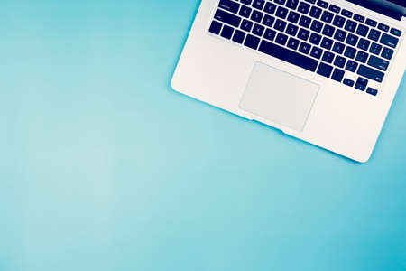 Flat lay of Laptop computer on desk in officeの写真素材