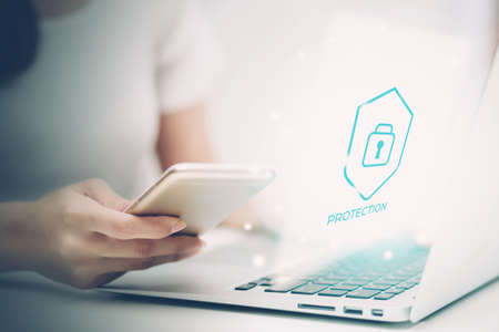 Digital network and cyber security for safe and privacy about data, businesswoman using laptop computer while display futuristic virtual lock login for protection crime and hacker, business concept.の写真素材