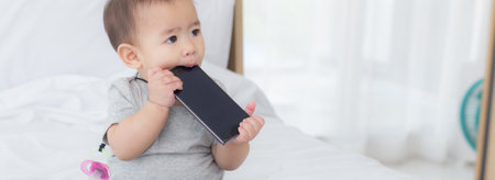 Portrait of cute little baby girl sitting with cozy on bed at bedroom, happiness of toddler, newborn...
