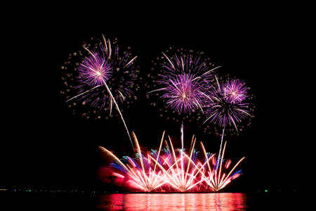 Many flashing colorful fireworks in event amazing with black background celebrate New Year, holiday...