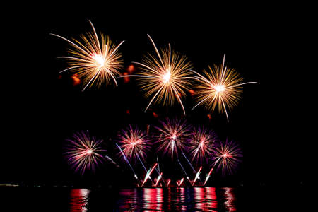 Many flashing colorful fireworks in event amazing with black background celebrate New Year, holiday...