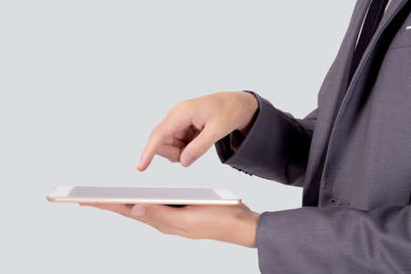 Young businessman using digital tablet computer isolated on white background, man holding tablet for...