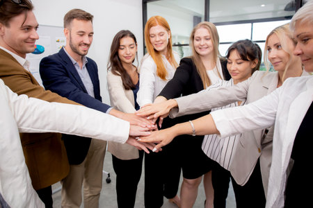 Group of business team harmonious with man and woman joining hands stack together in enterprise for...