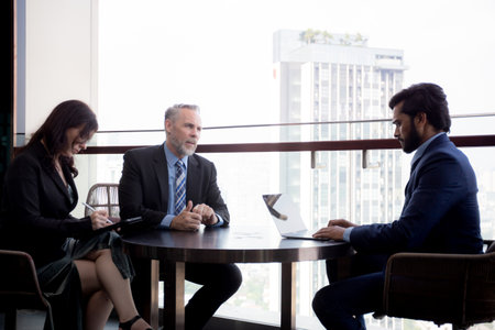 Senior executive or CEO and secretary talking and discussing for negotiation agreement and deal with...