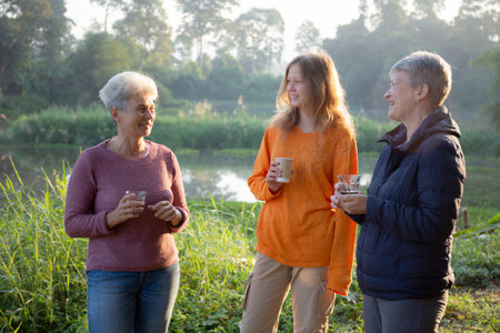 Two senior woman and teenager talking and leisure in camping, activity recreation and leisure picnic...