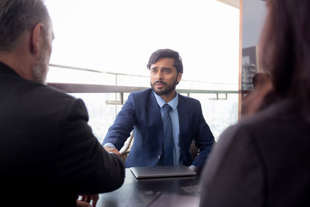 Senior executive or CEO and secretary talking and discussing for negotiation agreement and deal with partner about project together at office, business people meeting with consultant in team.の写真素材