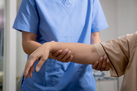 Hands nurse physiotherapy with elderly patient while stretch hands in hospital, senior exercise and workout with physiotherapist for rehabilitation and therapy arthritis, medical and caregiver.の写真素材