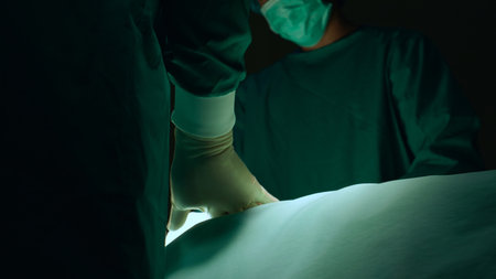 Group of team doctor and surgeon doing surgery with patient in the operation at hospital, medical and emergency, specialist and assistant rescue patient with expertise, surgical and health.の写真素材