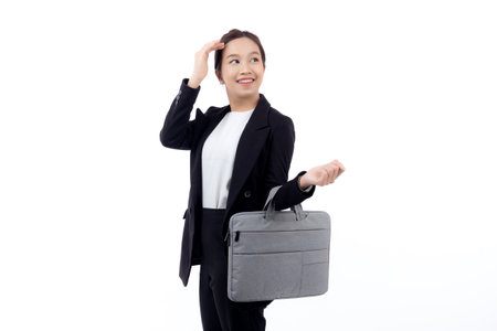 Beautiful portrait young business asian woman holding a briefcase isolated white background, confident businesswoman holding document bag, one person, employee contemporary, cut out.の写真素材