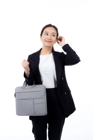Beautiful portrait young business asian woman holding a briefcase isolated white background, confident businesswoman holding document bag, one person, employee contemporary, cut out.の写真素材