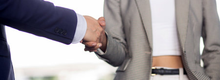 Closeup hands of businessman handshake with partner at office, business man negotiation and agreement for success and shaking hands, executive congratulations and greeting partnership for friendship.の写真素材